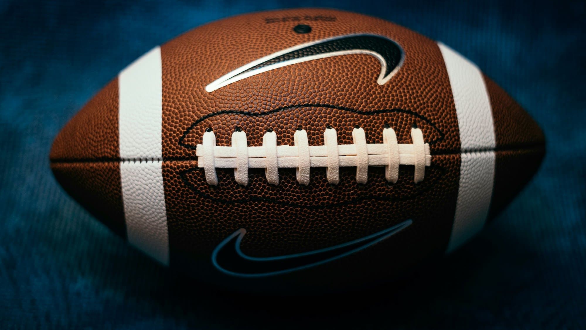 Close-up of a football, representing ESPN's live NFL coverage on ESPN Unlimited